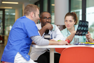 medical staff chatting in modern hospital canteen