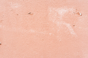 Fototapeta premium Rough pink wall. Close up view