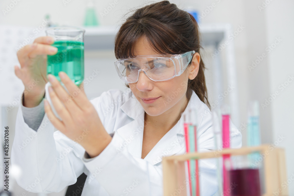 Wall mural a woman is working in lab