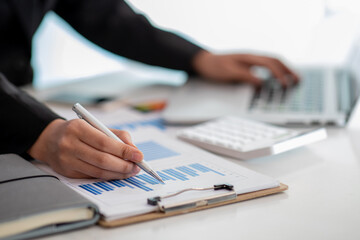 Close up of Businesswoman hands hold documents with financial statistic stock photo,discussion and...