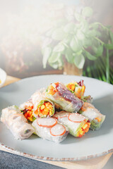 fresh springrolls with vegetables and shrimps. a healthy dish of rice paper and fresh organic vegetables