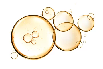 Foto op Plexiglas golden yellow bubble oil or serum isolated on white background © kaedeezign