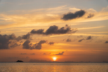 Naklejka na ściany i meble Beautiful sunset over the sea water on the island of Koh Phangan, Thailand