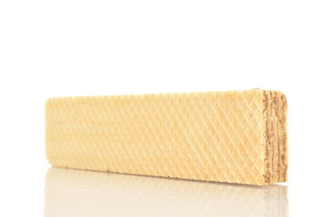 One sweet vanilla waffle, close-up, isolated on white.