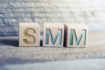 SMM Social Media Marketing Written On Wooden Blocks On A Board - Business Marketing Concept