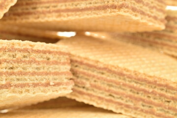Several vanilla waffles, close-up, isolated on white.