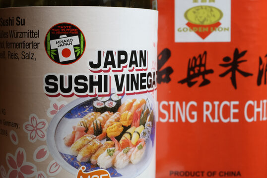 Viersen, Germany - May 1. 2021: Closeup of japanese miyako rice sushi vinegar bottle label, blurred chinese wine background