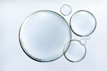 Clear water bubbles floats or serum on background