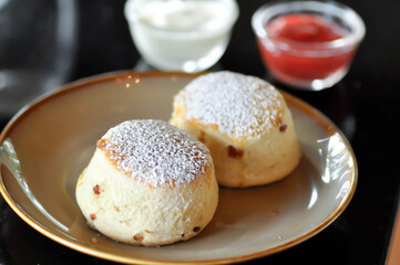 scone , scone with strawberry sauce and whipped cream