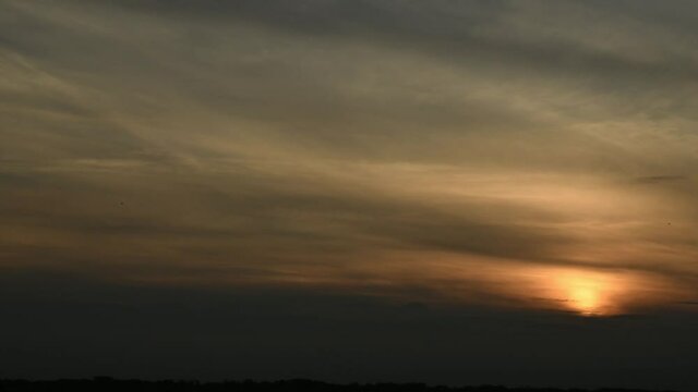 Sunset time lapse with meteorite passing by