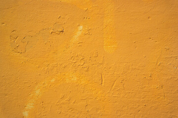 Yellow painted grungy wall texture
