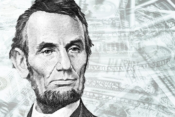 President Abraham Lincoln $5 looking sad with money background	
