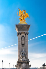 Paris, the Alexandre III bridge on the Seine, gilt bronze statue on the pylon

