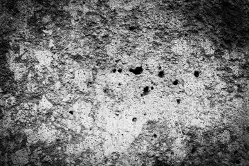 Old stone wall with holes. Close up view