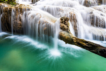 Waterfall and blue emerald water color in Erawan national park. Erawan Waterfall, Beautiful nature rock waterfall steps in tropical rainforest at Kanchanaburi province, Thailand