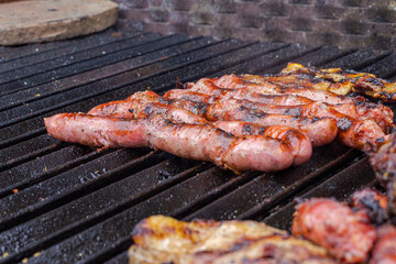Different types of meat cooked on barbecue and toast