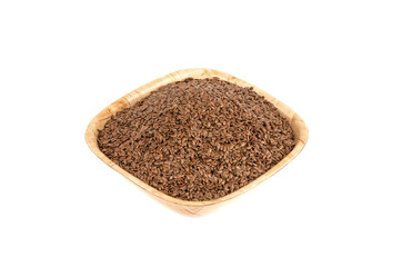Flax seeds in a wooden bowl isolated on white background.