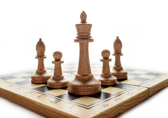 chess pieces on a board on a white background with copy space.