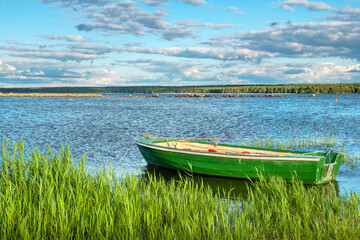Baltic sea coast and wooden boat. Vergi, Estonia - obrazy, fototapety, plakaty