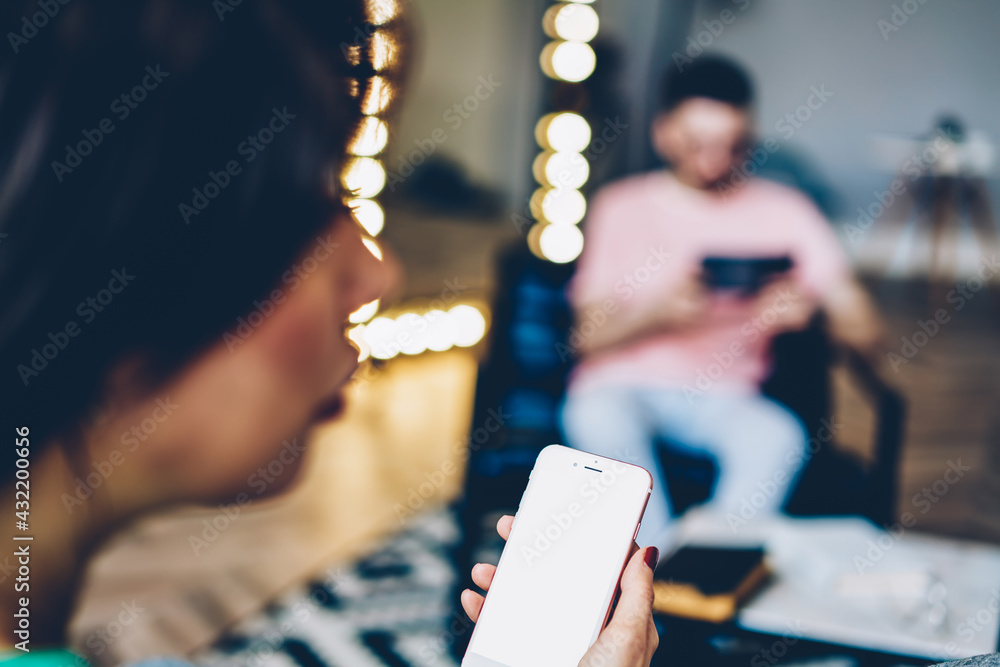 Aufkleber unrecognizable female blogger using home internet connection on mockup smartphone technology with co