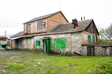 Obraz premium In rural areas, a universal building made of bricks oil mill grain slaughterhouse slaughterhouse Ukraine