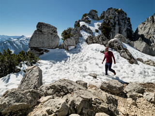 Lonely Hiker at the Bavarian Alps by feeling the freedom and blue sky roof below the Kampenwand