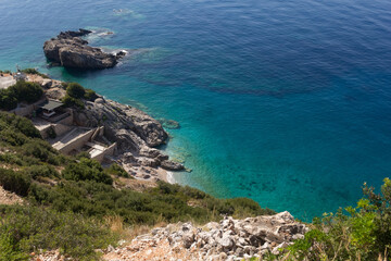 Small beach among rocks and turquoise sea, Albania. Travel and vacation theme, beautiful nature