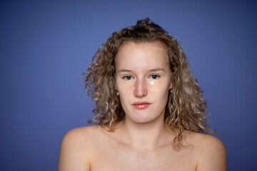 smiling light smile young beautiful girl with cosmetic patches for the area around the eyes, cleansing, skin improvement