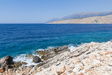 Fototapeta na wymiar Rocks and turquoise sea, Albania. Travel theme, beautiful nature.