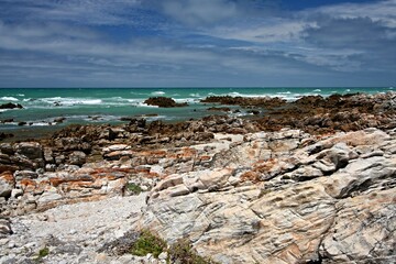 Fototapeta na wymiar Cape Agulhas. The southernmost place of the African continent. Interface by Atlantic Ocean and Indian Ocean. South African Republic.