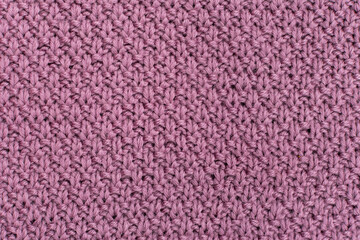 Fototapeta premium Knitted fabric pearl woolen background. The structure of the fabric with a natural texture. Fabric background. Knitted woolen background.
