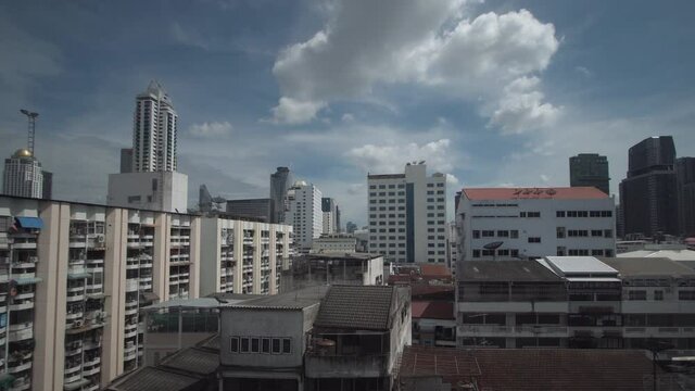 The city view out of the window of a moving train
