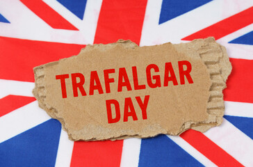 Against the background of the flag of Great Britain lies cardboard with the inscription - Trafalgar...