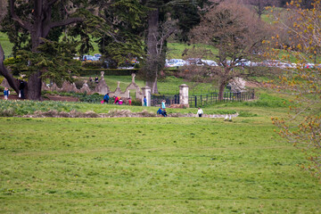 People walking and enjoying Ashton Court park in Bristol, UK