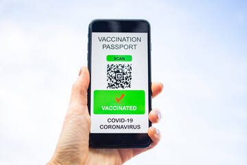 health Vaccine Passport for Coronavirus or Covid-19. Traveller Using Mobile Phone with Vaccination in Immune Status to Certificated International Traveling in Airport