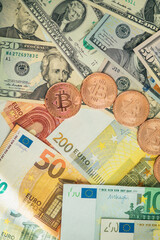 Money background. USA dollar with Euro Banknotes and Bitcoin cryptocurrency investing concept.