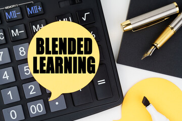 There is a calculator, a pen, a marker and a sticker with the inscription - BLENDED LEARNING