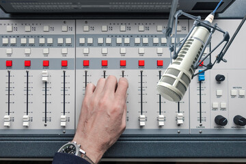 Professional microphone and sound mixer in radio station studio