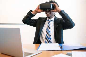 Businessman using virtual reality headset