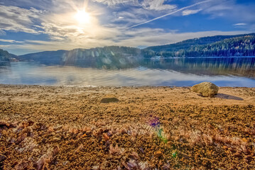 Schluchsee Lake in autumn, in the High Black Forest, Southwest Germany, with frost ripe on the shore