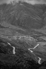 A black and white view of the sinuous Cuesta del Obispo road up the Andes, Salta Province,...