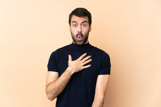 Caucasian Handsome Man Over Isolated Background Surprised And Shocked While Looking Right