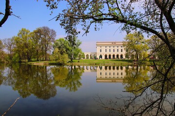 A beautiful reflection of scenery with castle Pohansko surrounded by trees and lake near Breclav, Czech republic