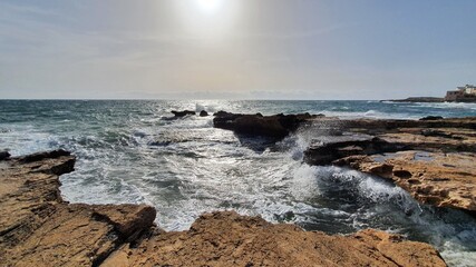 Waves crashing on rocks. Salt production. Discover the world. Heavy wind at the beach. Place to relax and enjoy tanning. Vacations in Lebanon. Amazing view