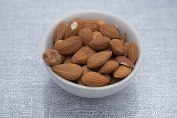 Dried almons in porcelain bowl