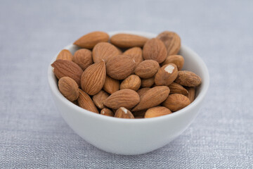 Dried almons in porcelain bowl