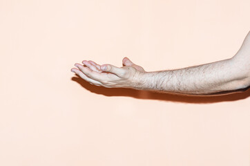Hand gesture on orange background. Pray gesture
