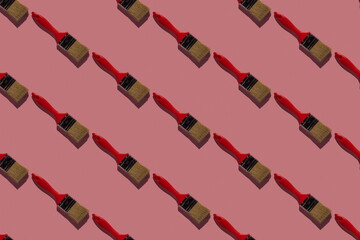 Brushes on a pink background. Seamless pattern. Hard shadows