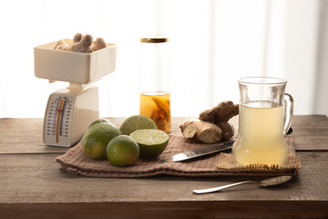table with cutting board with lemons and ginseng
