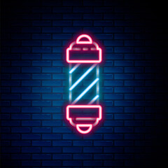 Obraz premium Glowing neon line Classic Barber shop pole icon isolated on brick wall background. Barbershop pole symbol. Colorful outline concept. Vector